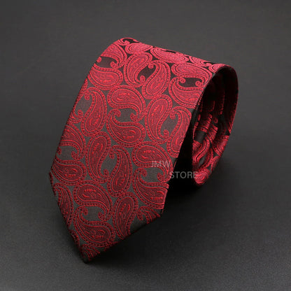 Red paisley patterned tie on a dark gray background