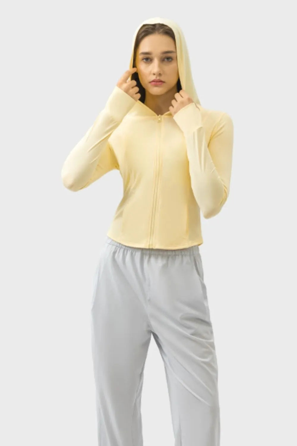 Millennia Pocketed Zip Up Hooded Long Sleeve Active Outerwear Carauana Store