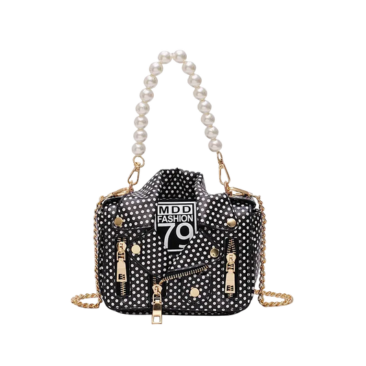 Black polka dot handbag with pearl handle and gold chain on a white background