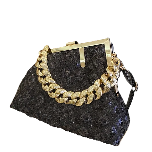 Black textured handbag with a gold chain detail on a white background