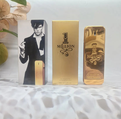 Gold '1 Million' perfume bottle and packaging on a textured surface