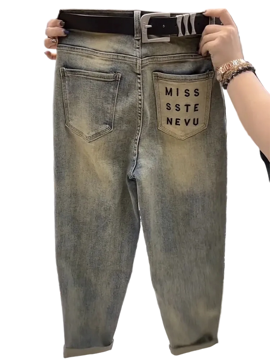 Denim jeans with 'MISS SSTE NEVU' branding