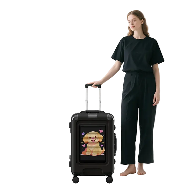 Person holding a black LOY Trolly Smart Suitcase - LED Programmable Smart Luggage with a cartoon dog design