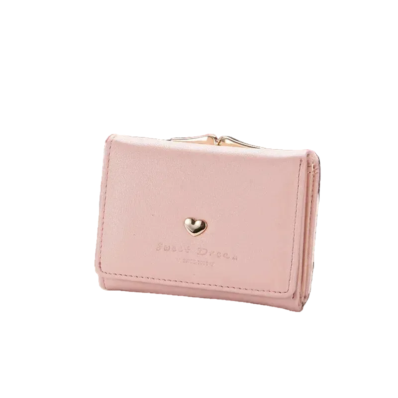 Pink wallet with a heart emblem on a magazine with sunglasses and bicycle in the background